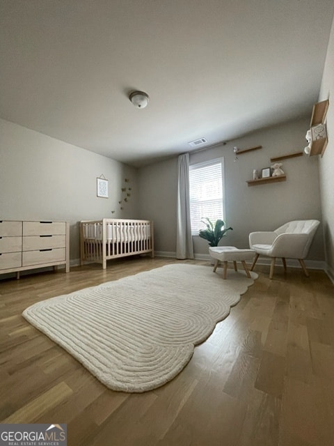 bedroom featuring wood-type flooring