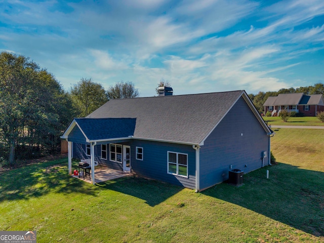 back of property featuring a patio area, a yard, and cooling unit