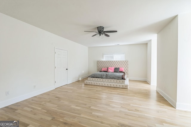 unfurnished bedroom featuring light hardwood / wood-style floors and ceiling fan