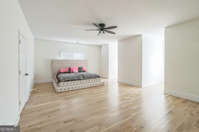 bedroom with ceiling fan and light wood-type flooring