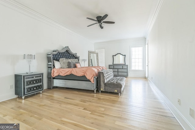 bedroom featuring ceiling fan, crown molding, and wood-type flooring