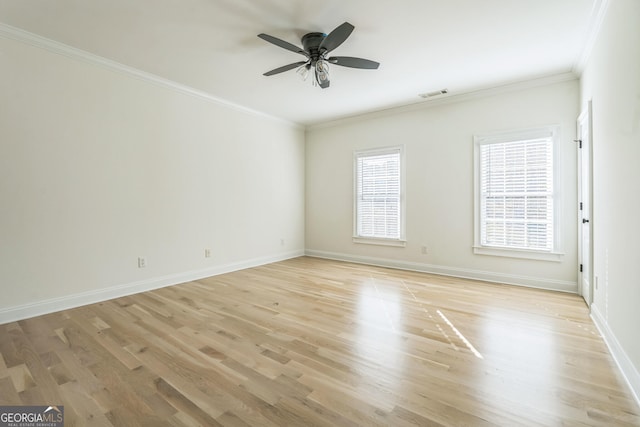 spare room featuring ceiling fan, light hardwood / wood-style floors, and crown molding