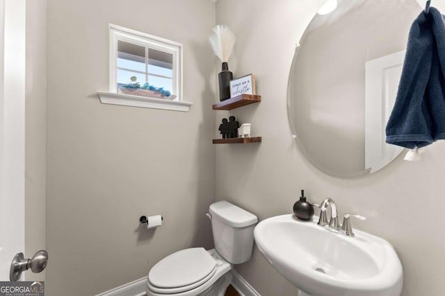 bathroom with sink and toilet