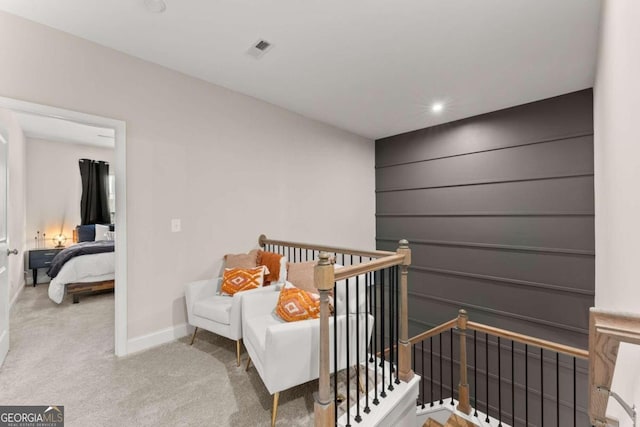 bedroom with a crib and carpet flooring