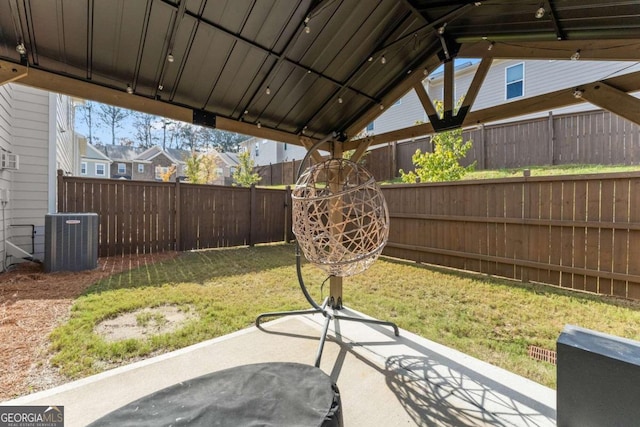 view of yard featuring a patio area and central air condition unit