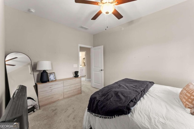 bedroom featuring light carpet and ceiling fan