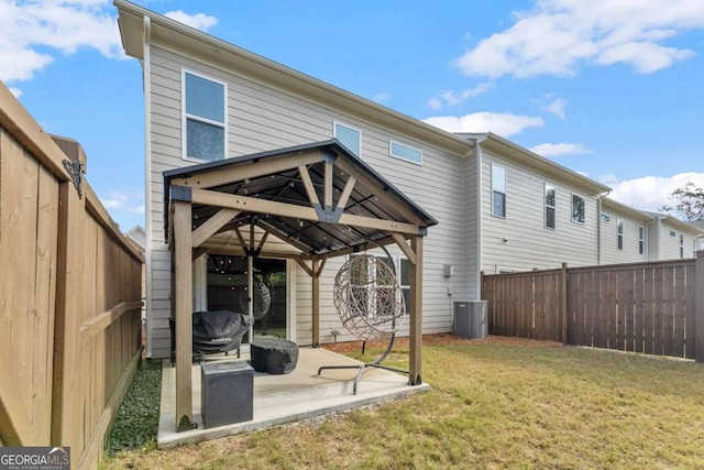 back of house with a yard, a gazebo, central AC, and a patio