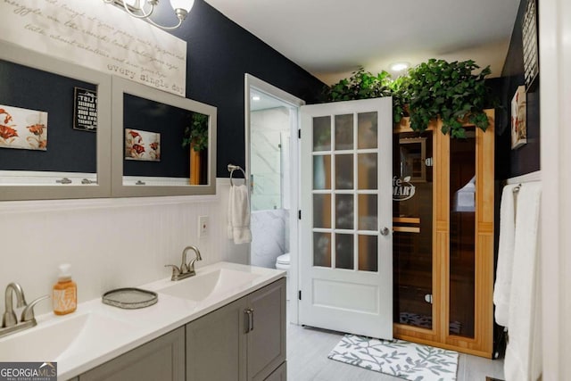 bathroom featuring vanity and toilet