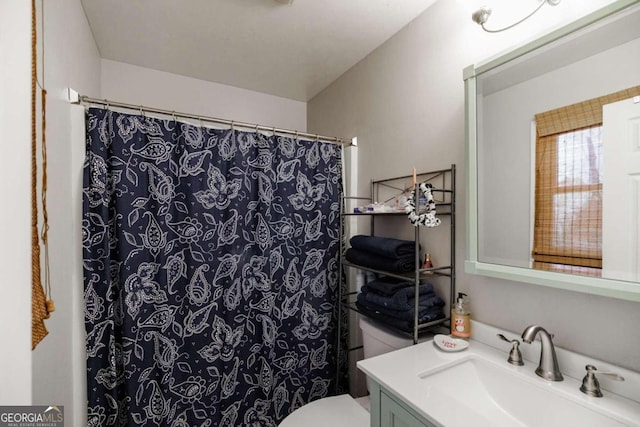 bathroom with vanity and toilet