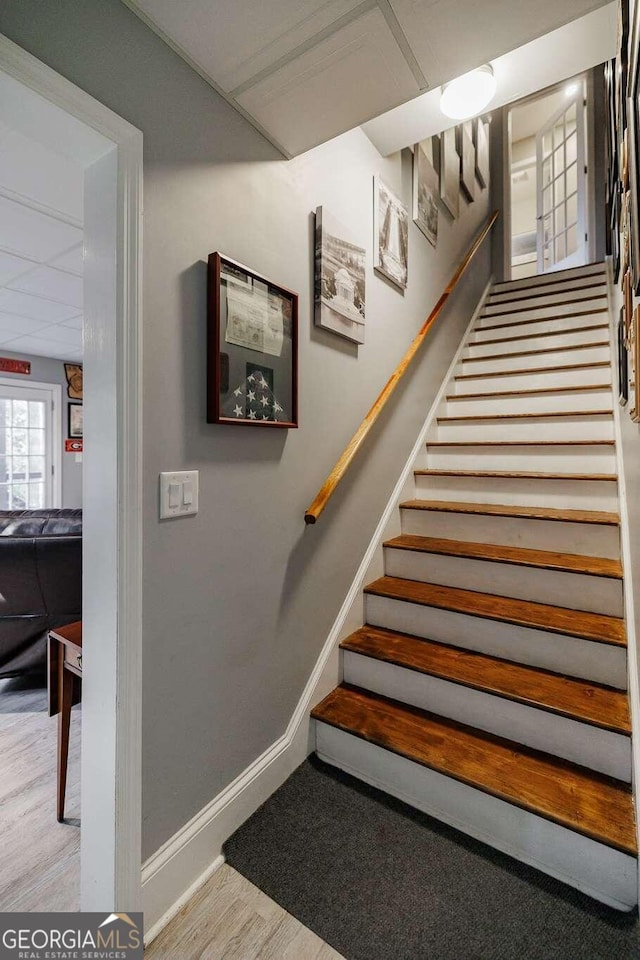 staircase featuring hardwood / wood-style flooring