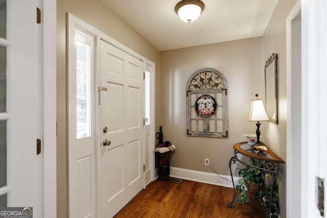 foyer entrance featuring dark hardwood / wood-style floors