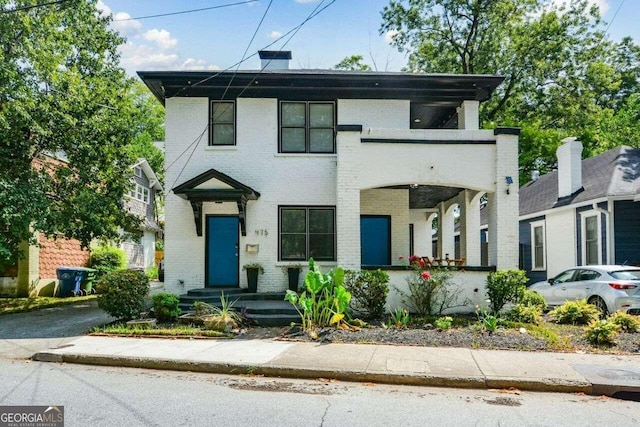 view of front of property featuring a balcony