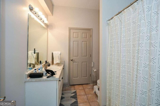 bathroom with curtained shower, tile patterned flooring, vanity, and toilet