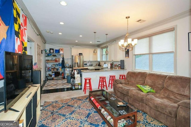 carpeted living room with crown molding and a chandelier