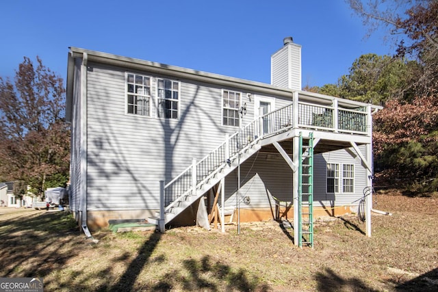 back of property featuring a deck