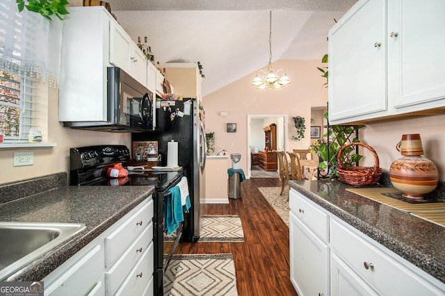 kitchen with dark hardwood / wood-style flooring, vaulted ceiling, black appliances, white cabinets, and hanging light fixtures