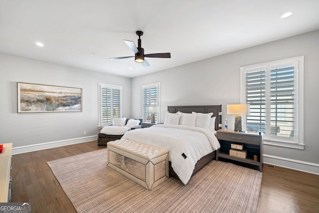 bedroom featuring ceiling fan and dark wood-type flooring