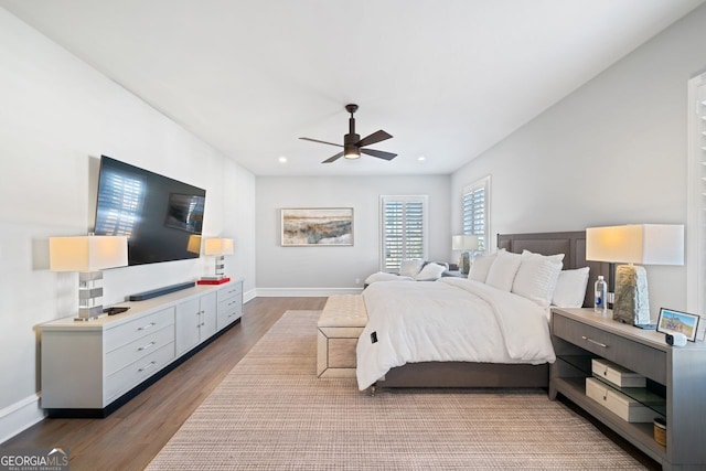 bedroom featuring ceiling fan and hardwood / wood-style floors