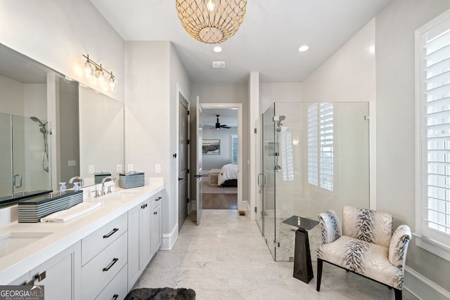 bathroom with walk in shower, vanity, and ceiling fan