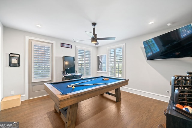 game room with ceiling fan, dark wood-type flooring, and billiards