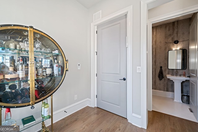 entryway with wood-type flooring