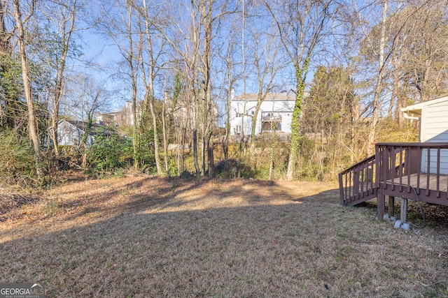 view of yard featuring a wooden deck