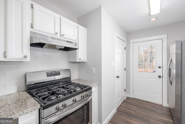 kitchen with white cabinets, dark hardwood / wood-style floors, and stainless steel appliances