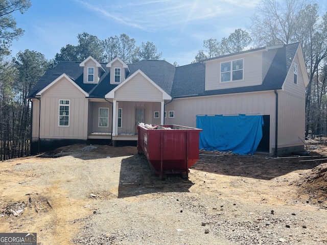 view of front of house featuring roof with shingles and board and batten siding