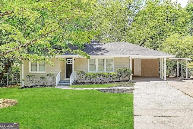 ranch-style house featuring a front lawn and a carport