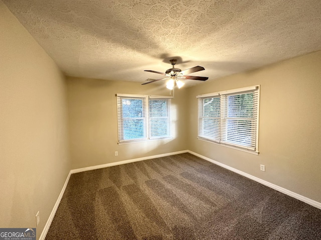 1737 Mckenzie Dr, Decatur, GA 30032 - unfurnished room featuring ceiling fan, dark carpet, and a textured ceiling