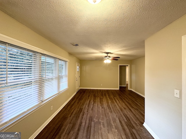 1737 Mckenzie Dr, Decatur, GA 30032 - empty room featuring dark wood-style flooring, a ceiling fan, and a textured ceiling