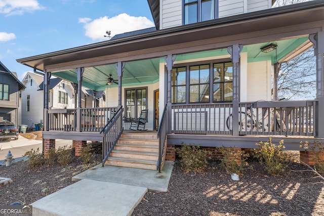 property entrance with covered porch and a ceiling fan