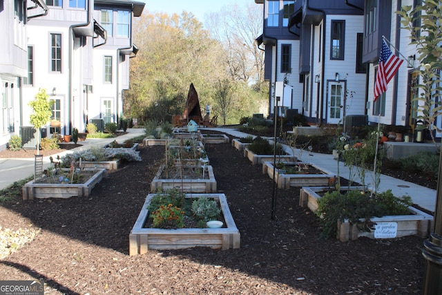 view of yard with a garden and cooling unit