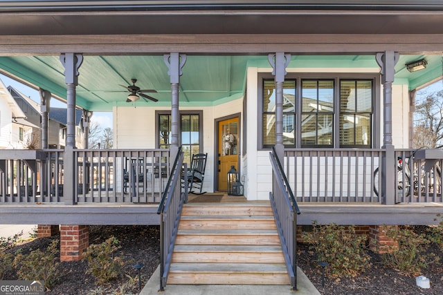 doorway to property featuring a porch and a ceiling fan