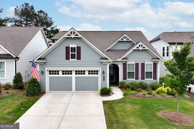 craftsman inspired home with a garage and a front yard