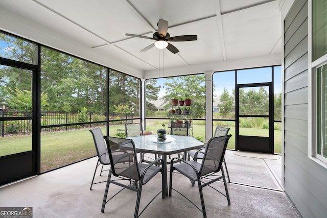 sunroom / solarium featuring ceiling fan