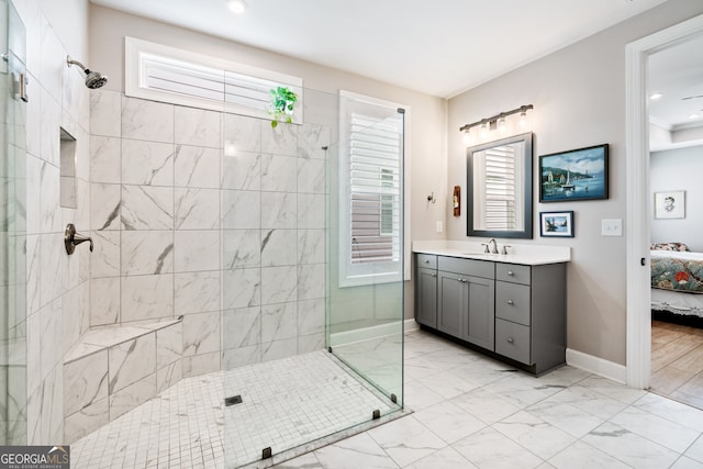 bathroom featuring vanity and tiled shower