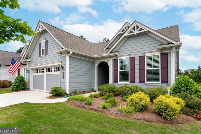 view of front facade featuring a garage and a front yard