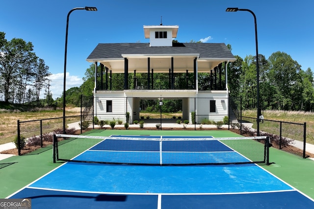 view of sport court featuring basketball hoop