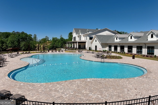 view of swimming pool featuring a patio area