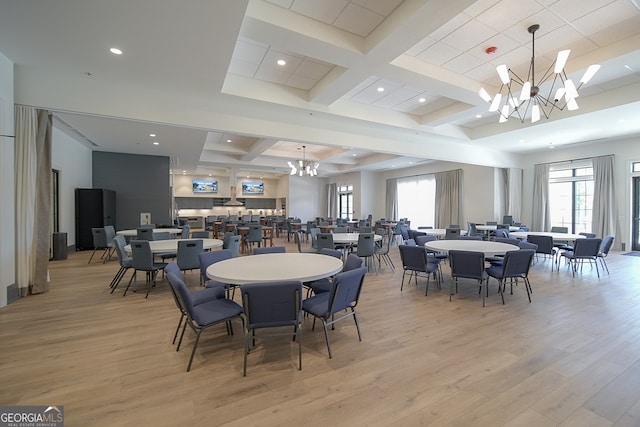 dining room featuring beamed ceiling, a chandelier, light hardwood / wood-style floors, and coffered ceiling