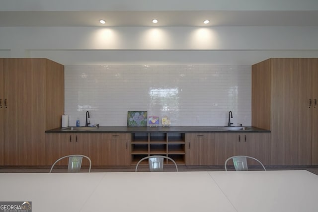 kitchen with backsplash and sink