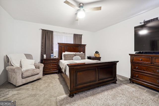 bedroom with light carpet and ceiling fan