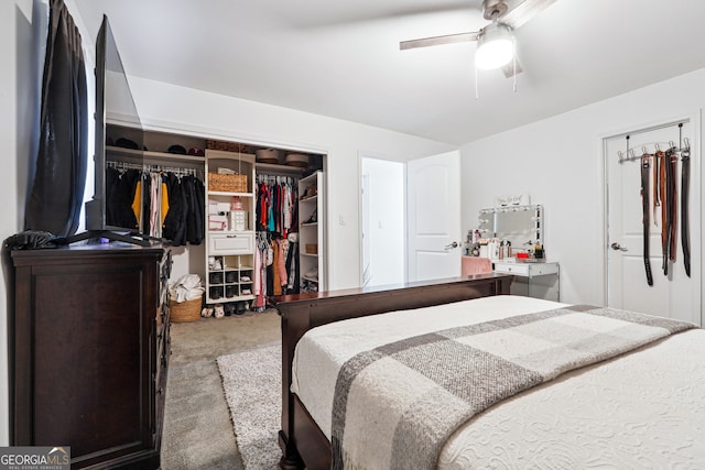 carpeted bedroom featuring a closet and ceiling fan