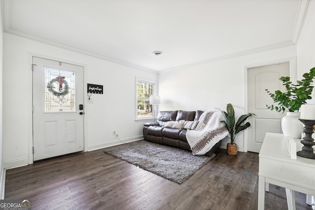 living room with dark hardwood / wood-style flooring and ornamental molding