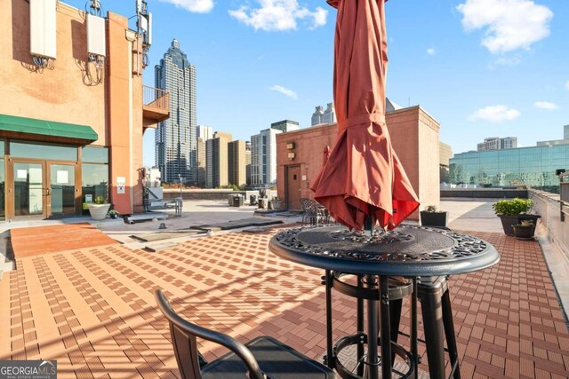 view of patio / terrace featuring a city view