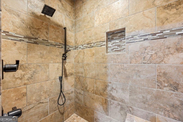 bathroom featuring tiled shower