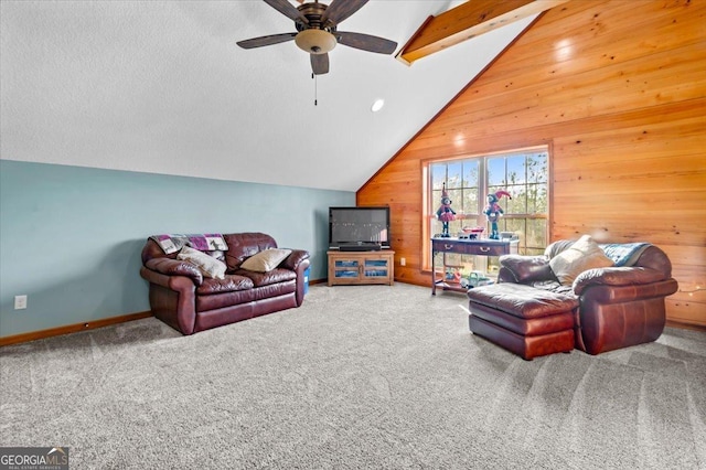 carpeted living room featuring ceiling fan, wood walls, and vaulted ceiling