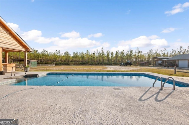 view of swimming pool with a patio