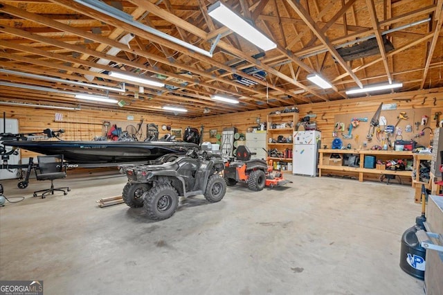 garage with a workshop area